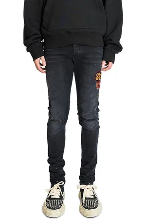 AMIRI Logo Patch Distressed Skinny Jeans