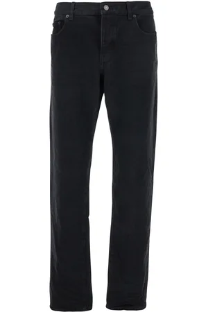 Saint Laurent Five Pocket Jeans With Logo Patch On The Back In Denim Man