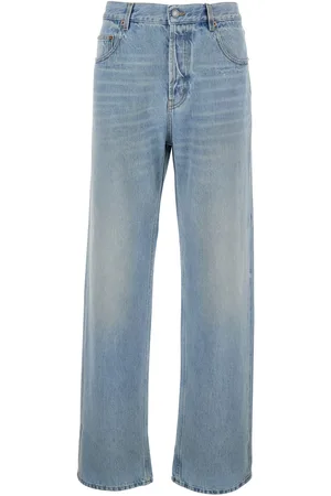 Saint Laurent Light Blue Five Pocket Jeans With Logo Patch On The Back In Denim Man