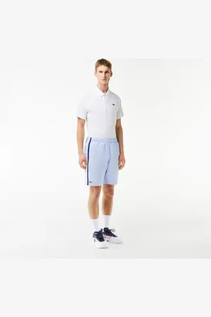 Lacoste Shorts de tenis ligeros con rayas color block para hombre