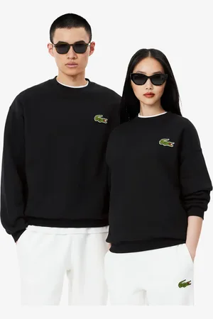 Lacoste Sudadera unisex de tejido polar con detalle de insignia y corte holgado