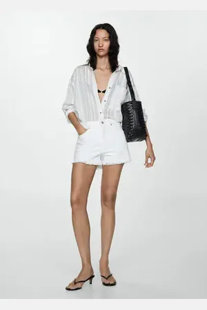 MANGO Shorts vaqueros bajo deshilachado