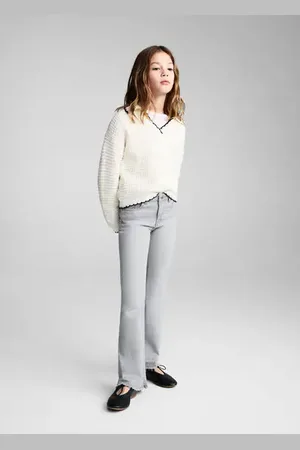 MANGO KIDS Jeans flare bajo deshilachado