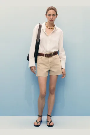 MANGO Shorts vaqueros bajo deshilachado