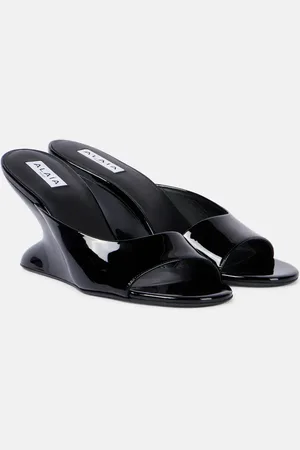 Alaïa AlaÃ¯a Curve 75 patent leather wedge mules