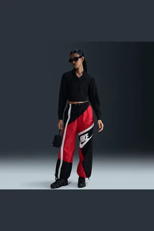 Nike Pants de tejido Woven de tiro medio holgados con dobladillo abierto para mujer Sportswear