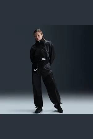 Nike Pants de tejido Woven de tiro medio holgados con dobladillo abierto para mujer Sportswear