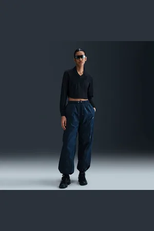 Nike Pants de tejido Woven de tiro medio holgados con dobladillo abierto para mujer Sportswear