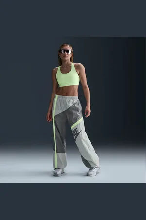 Nike Pants de tejido Woven de tiro medio holgados con dobladillo abierto para mujer Sportswear