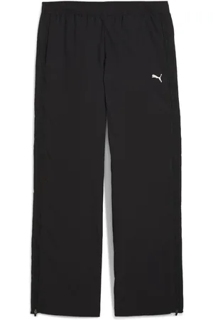 PUMA Pantalones de punto con cremallera estilo relajado DARE TO para mujer en Talla Chico en Negro |