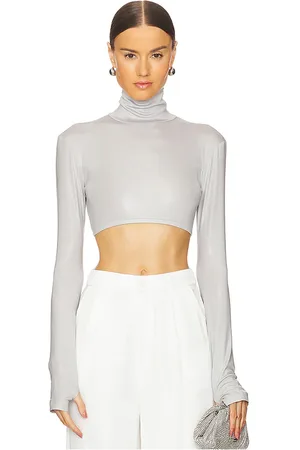 Norma Kamali Cropped slim fit long sleeve turtleneck top en color gris claro talla L en - Light Grey. Talla L (también en S, XL, X