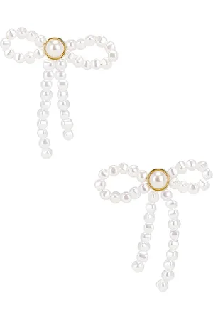 Lele Sadoughi Pendientes de tachuela pearl bow en color ivory talla all en - Ivory. Talla all.