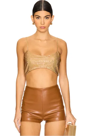 ALEXIS Polis top en color oro metálico talla M en - Metallic Gold. Talla M (también en S, XS).