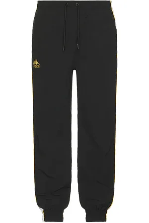 Kappa Pantalones deportivos 222 banda neldo en color negro talla L en Black Yellow Rich Gold & White - Black. Talla L (también en M, S).