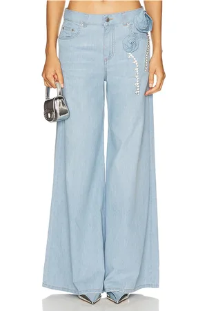 AREA Crystal rosette wide leg jean en color azul talla 27 en - Blue. Talla 27 (también en 29).