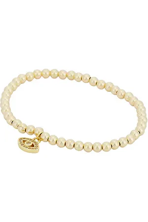 Alexa Leigh Pulsera con dijes evil eye en color oro metálico talla all en - Metallic Gold. Talla all.